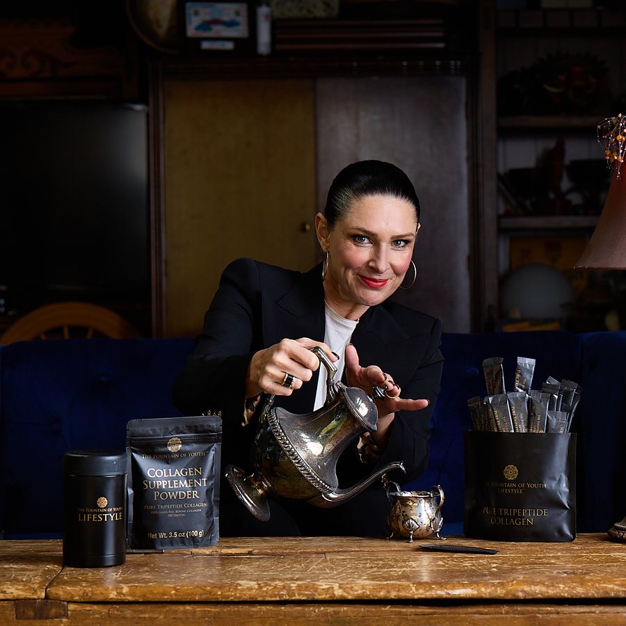 Jacqui Hutton, founder, pouring from a silver teapot beside Collagen Supplement Powder bags
